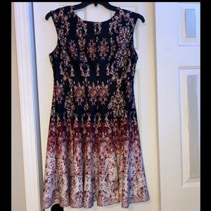 A Danny and Nicole black and magenta colored dress size 14. Barley ever worn.